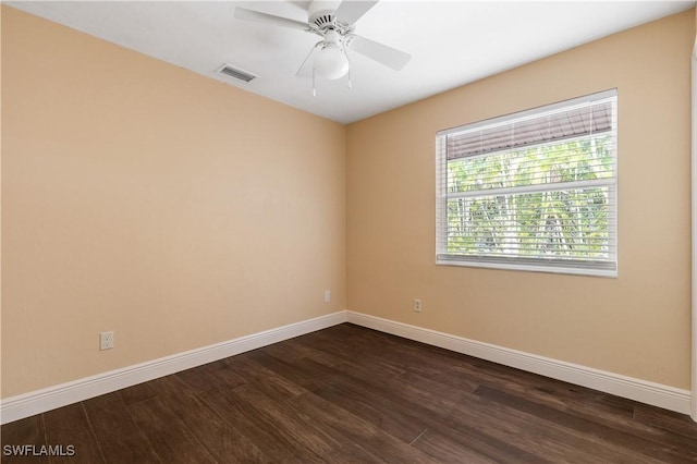 2020 Aruba Ave, Fort Myers, FL 33905 - unfurnished room with baseboards, dark wood-style flooring, and a ceiling fan