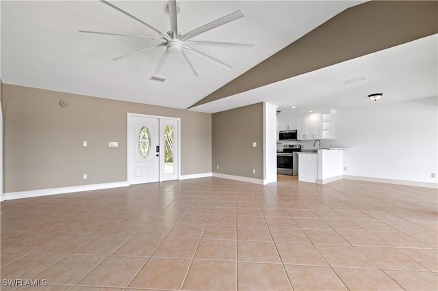 2020 Aruba Ave, Fort Myers, FL 33905 - unfurnished living room with ceiling fan, light tile patterned floors, baseboards, high vaulted ceiling, and a sink
