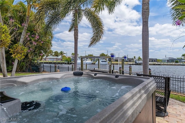 2020 Aruba Ave, Fort Myers, FL 33905 - view of swimming pool featuring a water view, a hot tub, and a dock