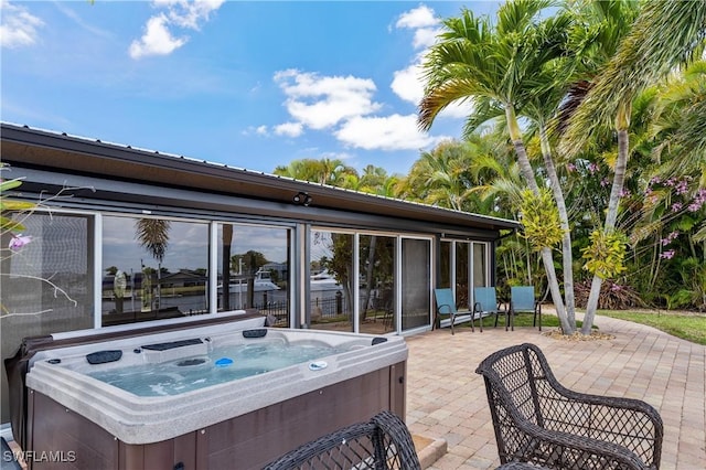 2020 Aruba Ave, Fort Myers, FL 33905 - view of patio / terrace with a hot tub