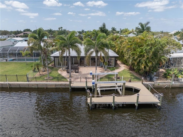 2020 Aruba Ave, Fort Myers, FL 33905 - dock featuring a water view, a patio, and boat lift