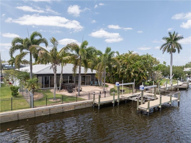 2020 Aruba Ave, Fort Myers, FL 33905 - dock area with a water view, a fenced backyard, boat lift, and a patio