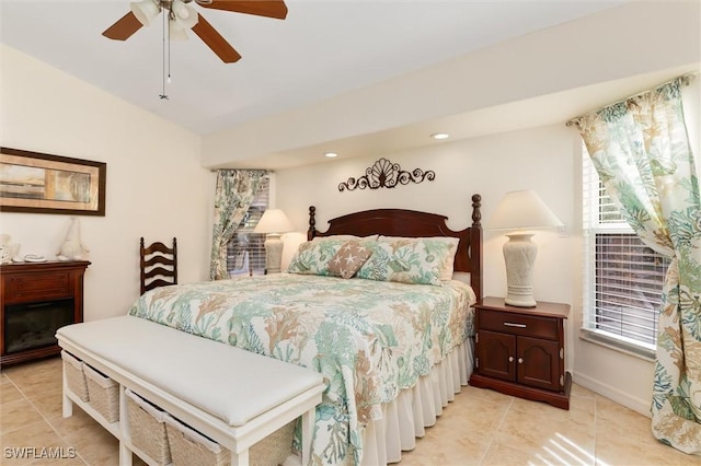 bedroom with light tile patterned flooring, vaulted ceiling, ceiling fan, and recessed lighting