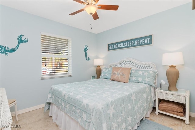 bedroom with tile patterned floors, baseboards, and a ceiling fan