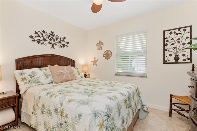 bedroom with baseboards, ceiling fan, and tile patterned floors
