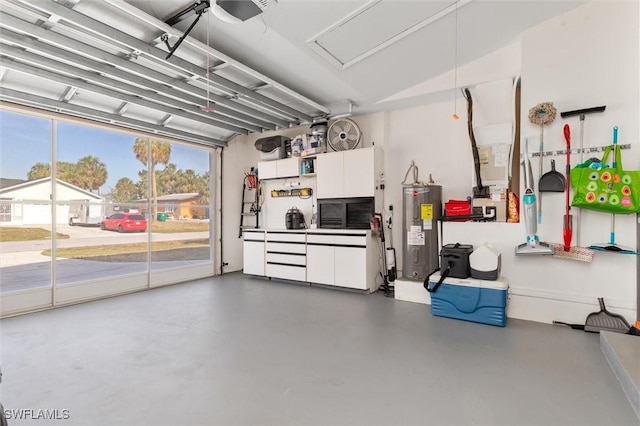 garage featuring water heater and a garage door opener