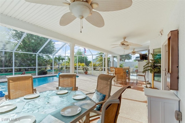 exterior space with outdoor dining space, a lanai, and an outdoor pool
