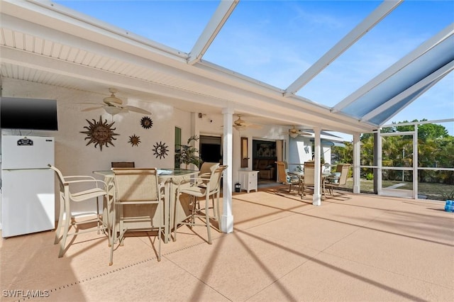 exterior space with beam ceiling and a skylight