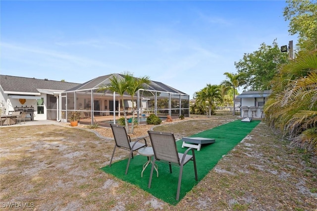 view of yard featuring a lanai and a patio area