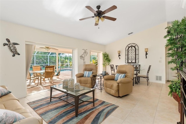 living room with light tile patterned floors, visible vents, and a ceiling fan