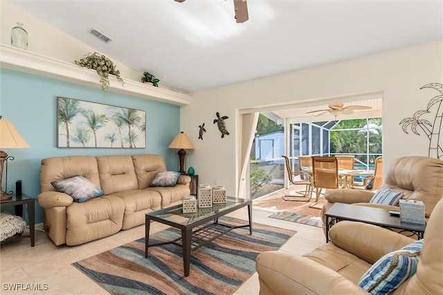 living room with light tile patterned flooring, a sunroom, ceiling fan, and visible vents
