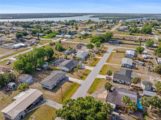 aerial view featuring a water view and a residential view