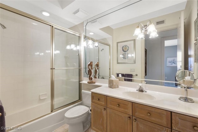 full bath featuring visible vents, bath / shower combo with glass door, toilet, and vanity