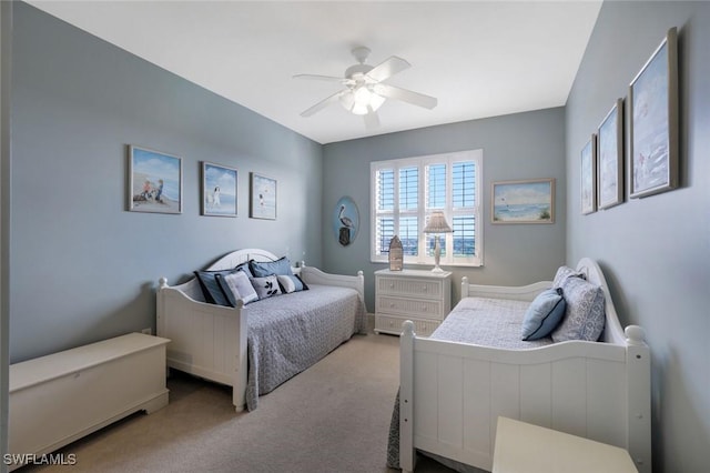 carpeted bedroom with a ceiling fan