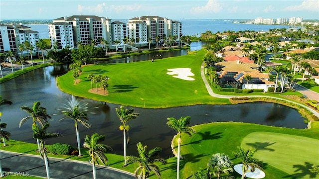 bird's eye view featuring a water view and view of golf course
