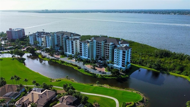 bird's eye view featuring view of golf course and a water view