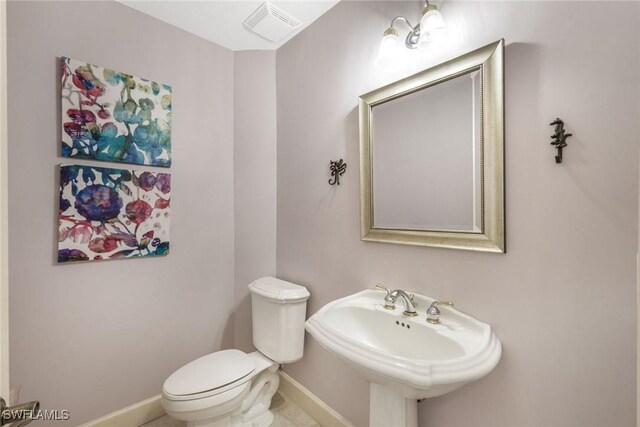 11600 Court Of Palms Unit 506, Fort Myers, FL 33908 - bathroom featuring toilet, baseboards, and a sink