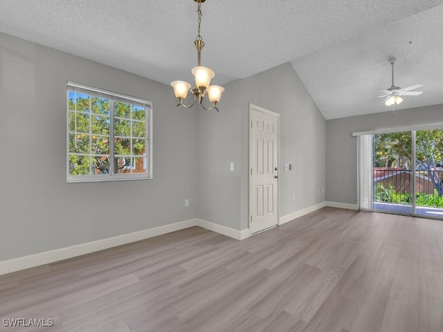 1180 Wildwood Lakes Blvd Unit 207, Naples, FL 34104 - spare room with a textured ceiling, wood finished floors, and a healthy amount of sunlight