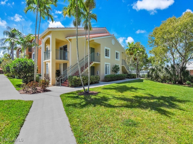 1180 Wildwood Lakes Blvd Unit 207, Naples, FL 34104 - view of property featuring stairs