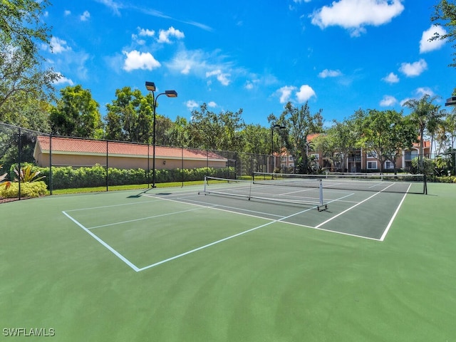 1180 Wildwood Lakes Blvd Unit 207, Naples, FL 34104 - view of sport court with fence and community basketball court