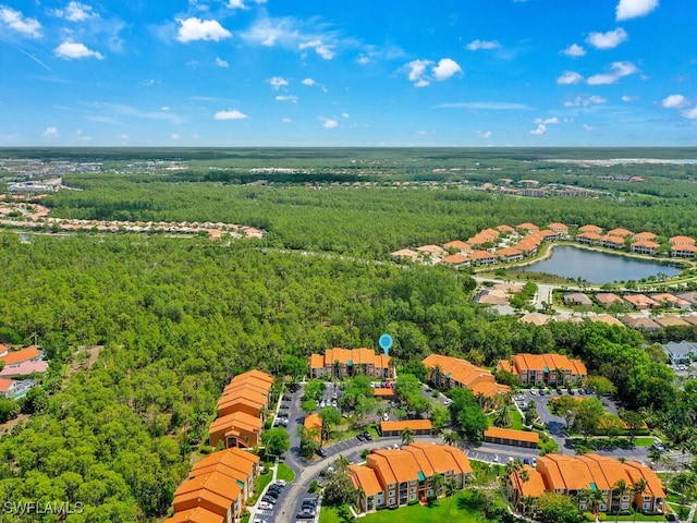 1180 Wildwood Lakes Blvd Unit 207, Naples, FL 34104 - bird's eye view with a water view and a forest view
