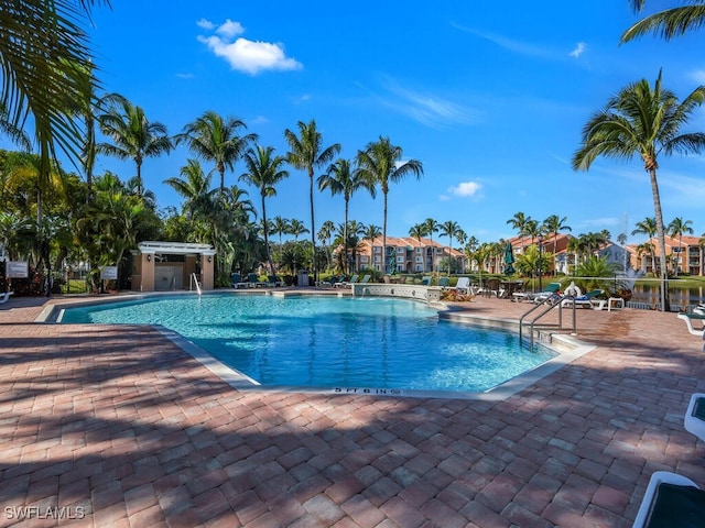 1180 Wildwood Lakes Blvd Unit 207, Naples, FL 34104 - pool with a patio