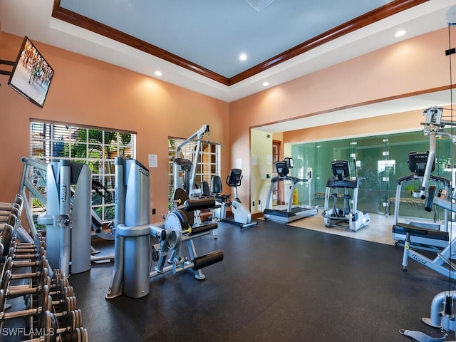 1180 Wildwood Lakes Blvd Unit 207, Naples, FL 34104 - workout area featuring recessed lighting, plenty of natural light, a tray ceiling, and ornamental molding