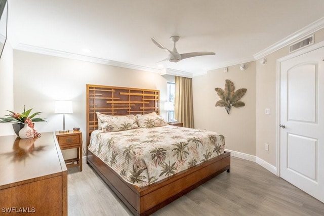10 Tampa Pl Unit 401, Marco Island, FL 34145 - bedroom with baseboards, visible vents, light wood-type flooring, and crown molding