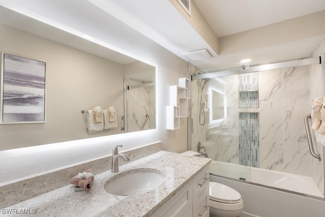 10 Tampa Pl Unit 401, Marco Island, FL 34145 - full bathroom with toilet, enclosed tub / shower combo, vanity, and visible vents