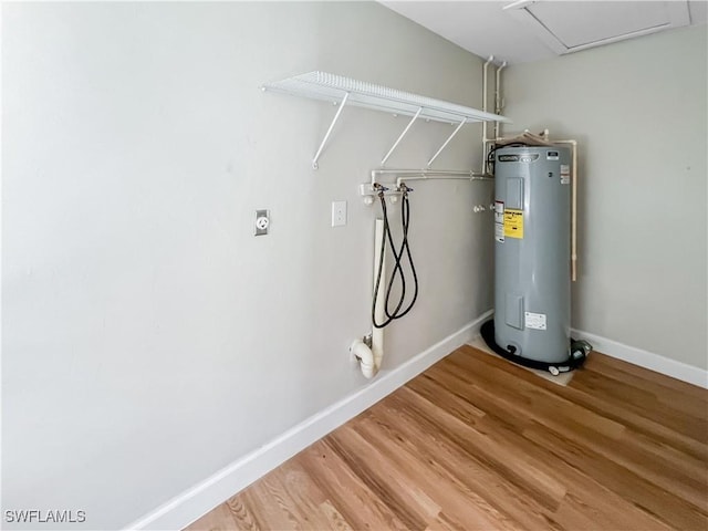 utility room featuring water heater