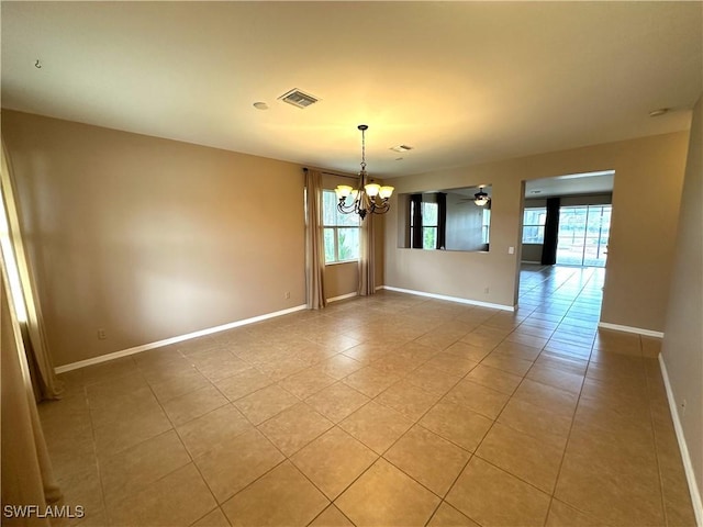 8091 Allamanda Ct, Lehigh Acres, FL 33972 - spare room featuring plenty of natural light, baseboards, visible vents, and light tile patterned flooring