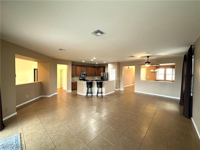 8091 Allamanda Ct, Lehigh Acres, FL 33972 - unfurnished living room with baseboards, visible vents, recessed lighting, and light tile patterned floors