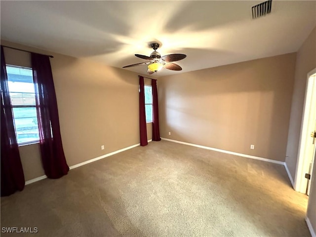 8091 Allamanda Ct, Lehigh Acres, FL 33972 - unfurnished bedroom with baseboards, visible vents, carpet, and a ceiling fan