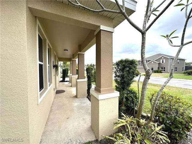 8091 Allamanda Ct, Lehigh Acres, FL 33972 - view of patio / terrace featuring covered porch