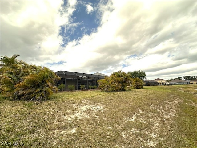8091 Allamanda Ct, Lehigh Acres, FL 33972 - view of yard featuring glass enclosure