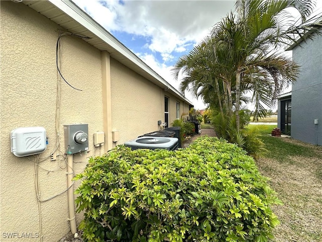 8091 Allamanda Ct, Lehigh Acres, FL 33972 - view of property exterior with stucco siding