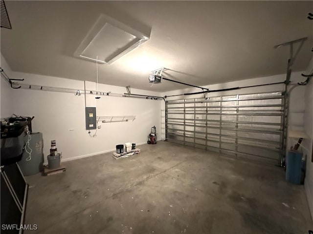 8091 Allamanda Ct, Lehigh Acres, FL 33972 - garage featuring electric panel and a garage door opener