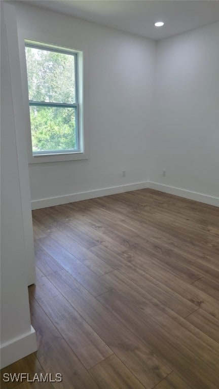 5005 Eifel Ln, Labelle, FL 33935 - unfurnished room featuring dark wood-type flooring and recessed lighting