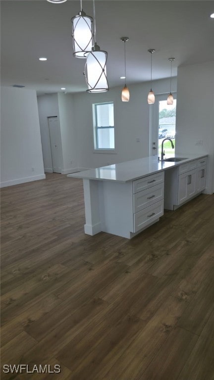 5005 Eifel Ln, Labelle, FL 33935 - kitchen featuring white cabinets, dark wood-style floors, plenty of natural light, pendant lighting, and recessed lighting
