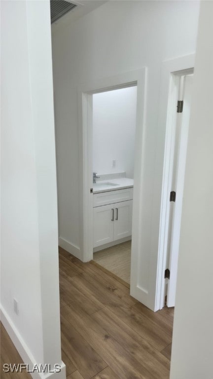 5005 Eifel Ln, Labelle, FL 33935 - hall featuring light wood finished floors and a sink
