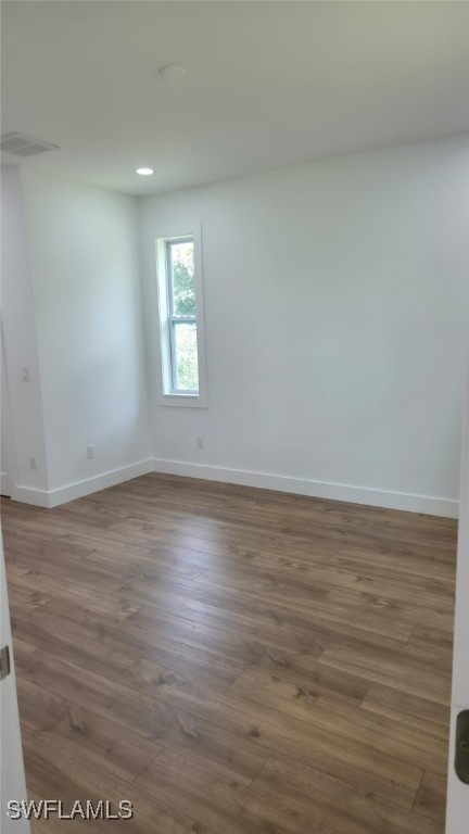 5005 Eifel Ln, Labelle, FL 33935 - unfurnished room featuring wood finished floors and recessed lighting