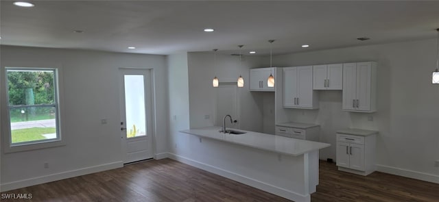 5005 Eifel Ln, Labelle, FL 33935 - kitchen with a peninsula, dark wood-style floors, white cabinetry, recessed lighting, and light countertops