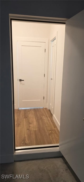 5005 Eifel Ln, Labelle, FL 33935 - hallway featuring baseboards and wood finished floors
