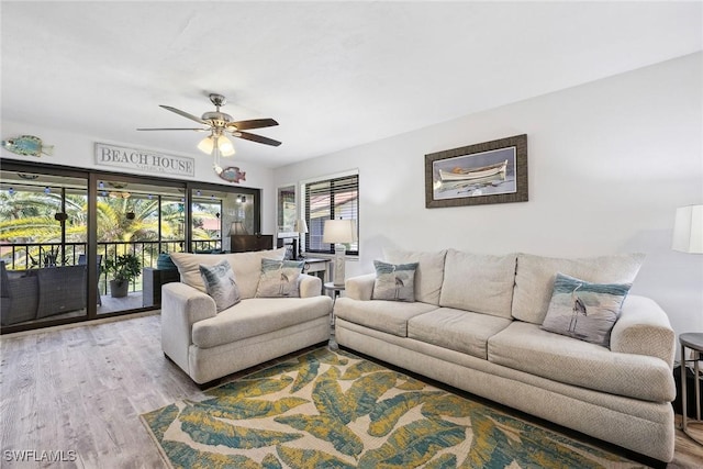 4967 Pepper Cir Unit 206, Naples, FL 34113 - living area with wood finished floors and a ceiling fan