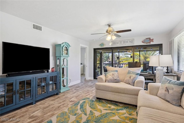 4967 Pepper Cir Unit 206, Naples, FL 34113 - living area featuring ceiling fan, wood finished floors, and baseboards