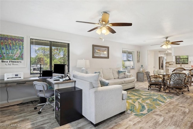 4967 Pepper Cir Unit 206, Naples, FL 34113 - living area with ceiling fan, an office area, and wood finished floors