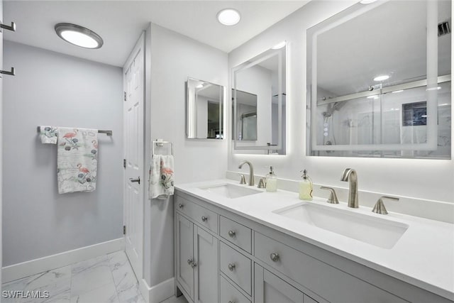 4967 Pepper Cir Unit 206, Naples, FL 34113 - full bathroom with marble look tile flooring, baseboards, double vanity, and a shower stall