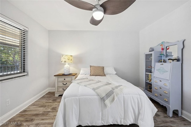 4967 Pepper Cir Unit 206, Naples, FL 34113 - bedroom featuring wood finished floors, baseboards, and ceiling fan