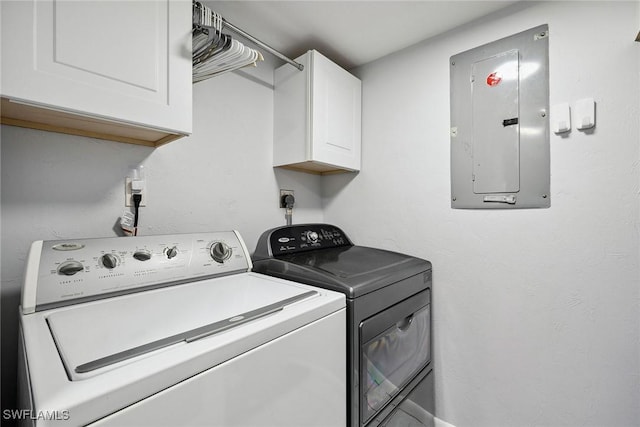 4967 Pepper Cir Unit 206, Naples, FL 34113 - washroom with cabinet space, electric panel, and washing machine and clothes dryer