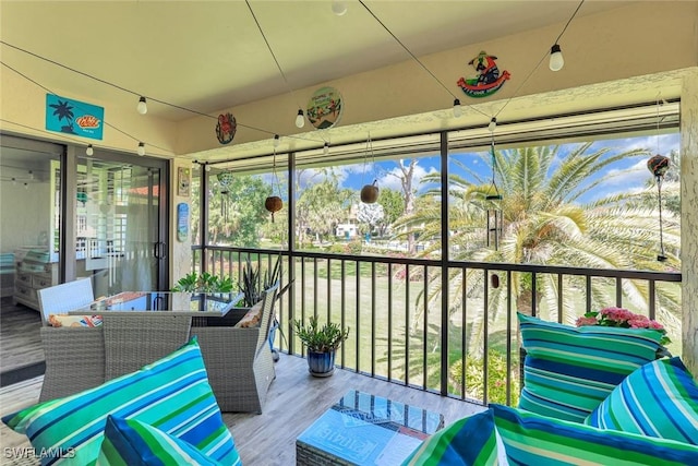 4967 Pepper Cir Unit 206, Naples, FL 34113 - sunroom featuring outdoor dining area